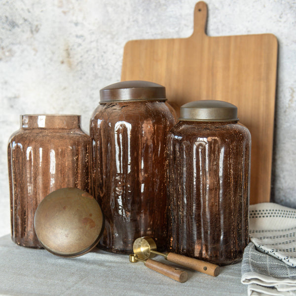 9.75" AMBER GLASS JAR W/ ANTIQUE LID